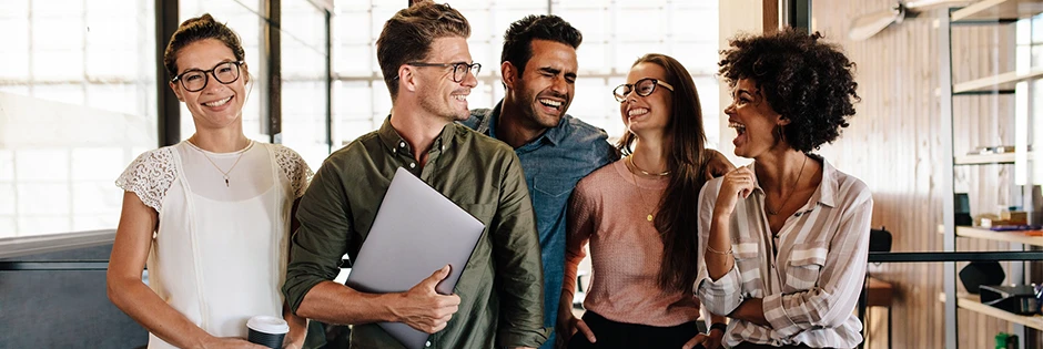 Group of five smiling professionals